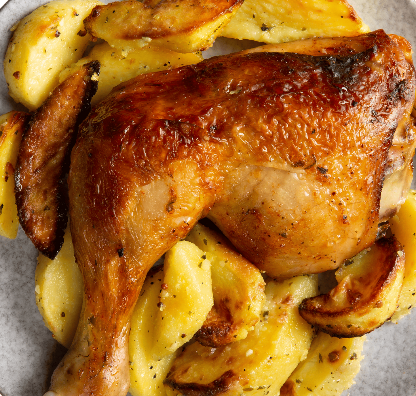 Roasted Chicken on bed of Potatos