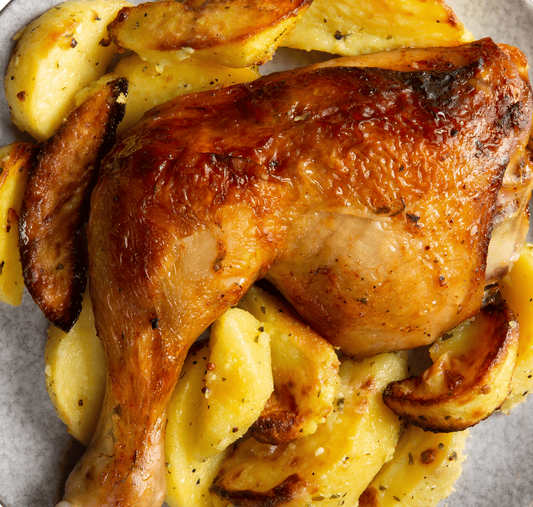 Roasted Chicken on bed of Potatos