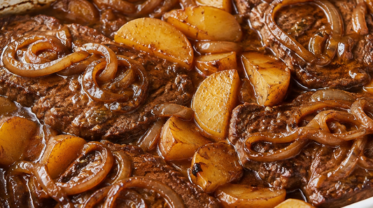 Tender minute steak with onions and potatoes
