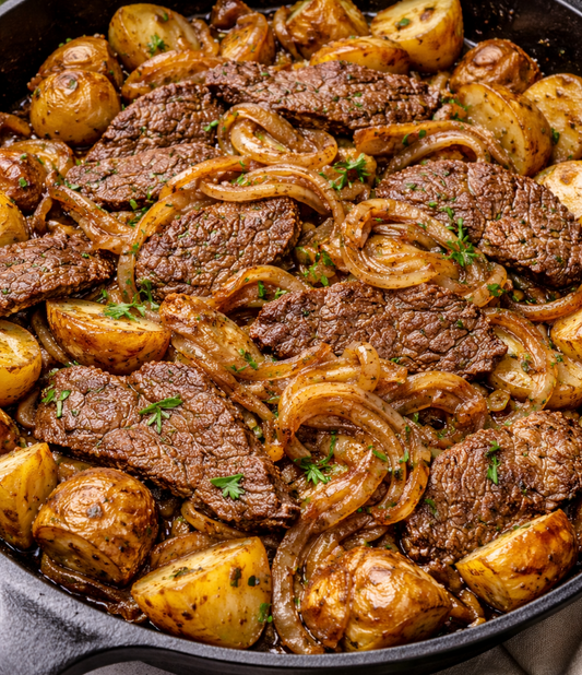 Tender minute steak with onions and potatoes